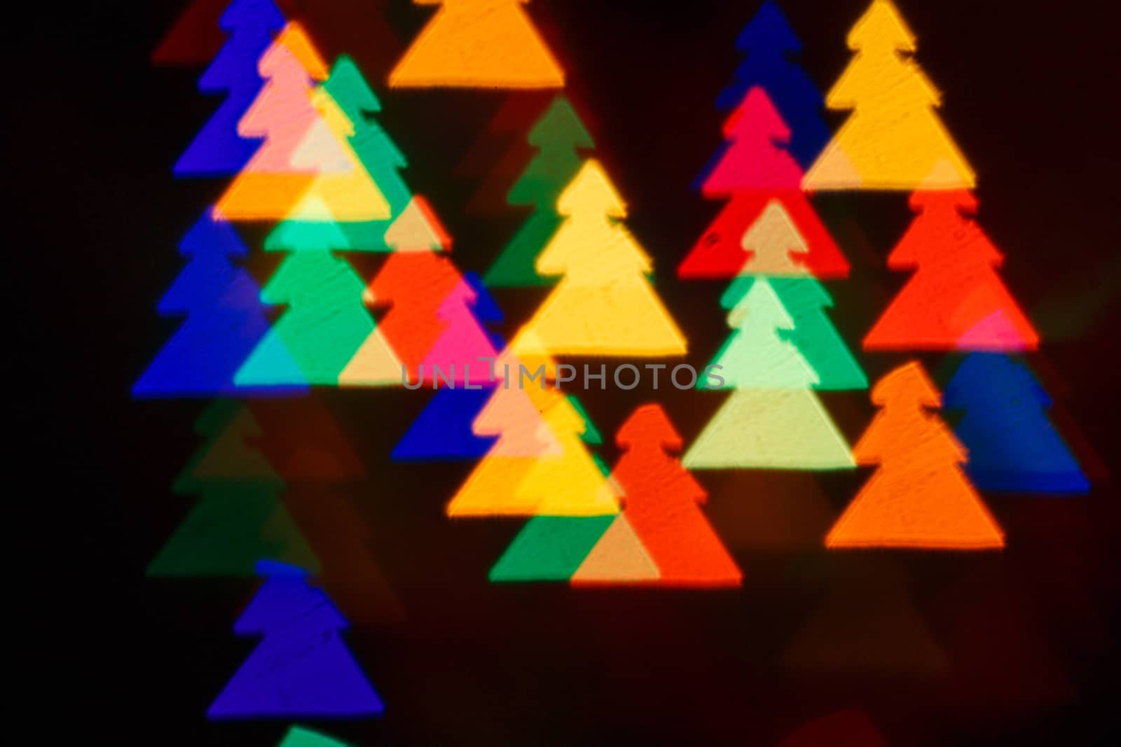 Defocused christmas background in multi-colored fir shot closeup