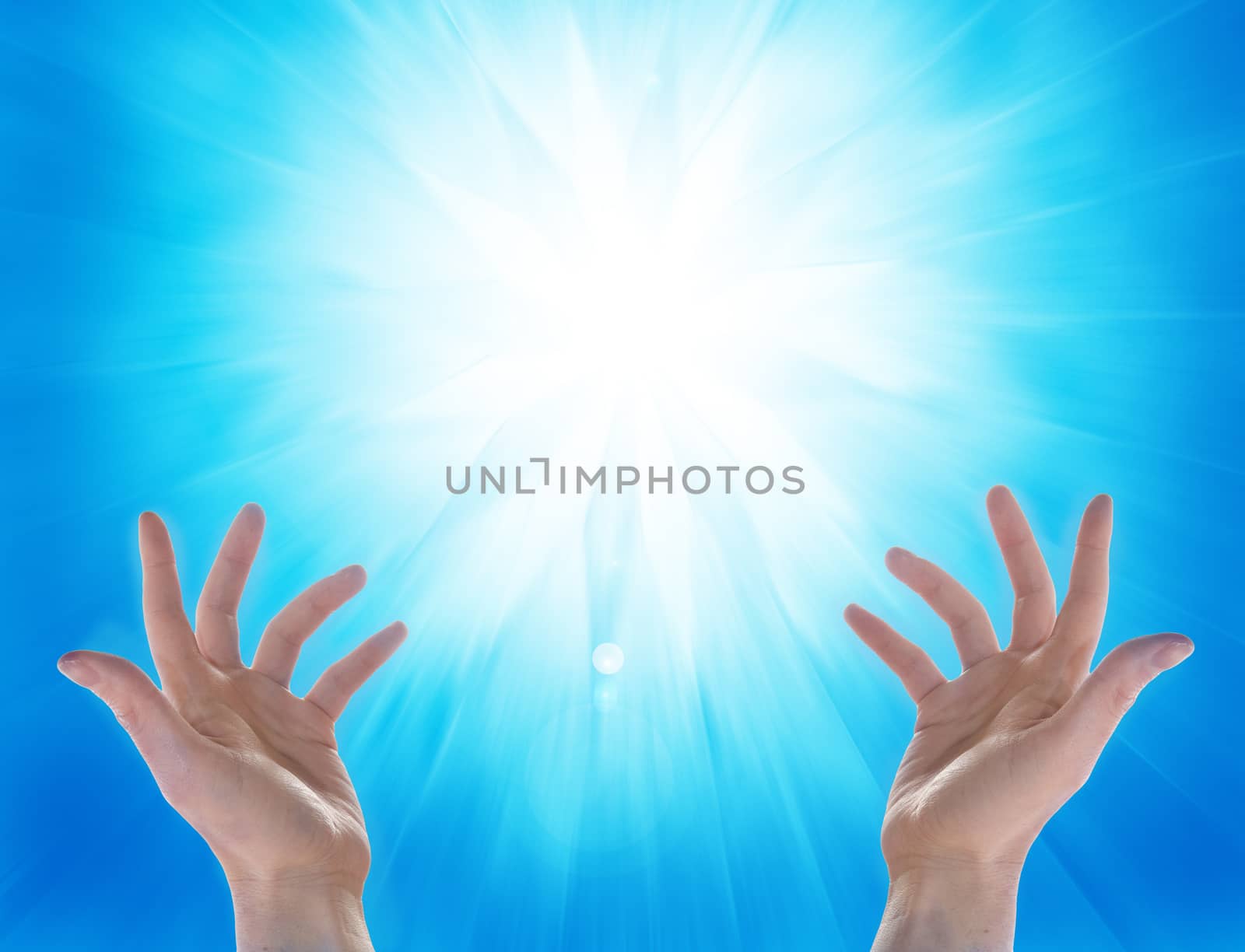 hands and sun on blu background