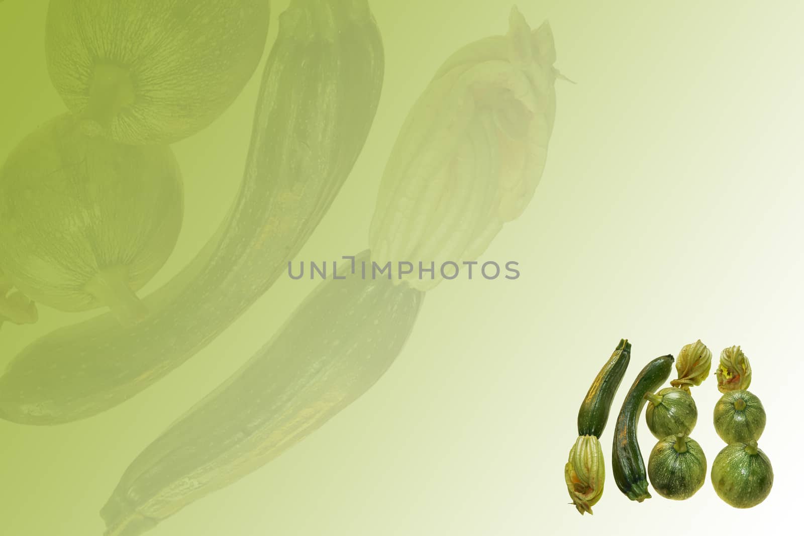 some ripe courgette on green background