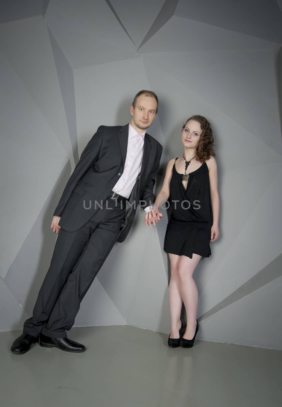 man and woman in love on a grey background