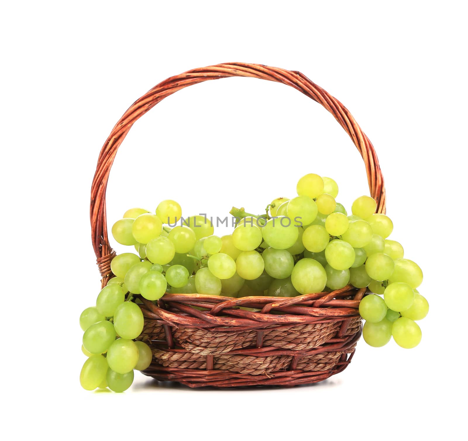 Bunch of white grapes in a basket. Isolated on a white background.