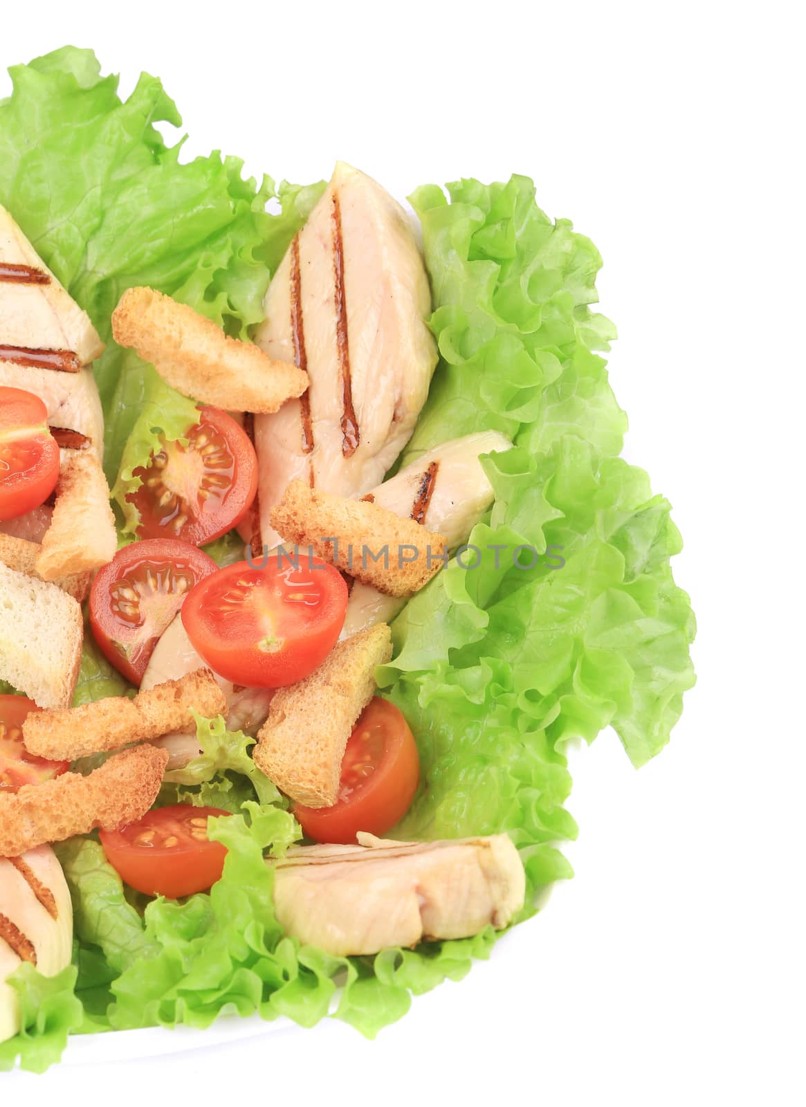 Caesar salad with tomatoes cherry. Isolated on a white background.