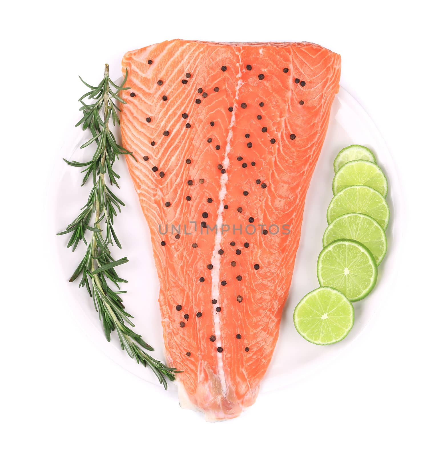 Salmon fillet with lime and rosemary. Isolated on a white background.