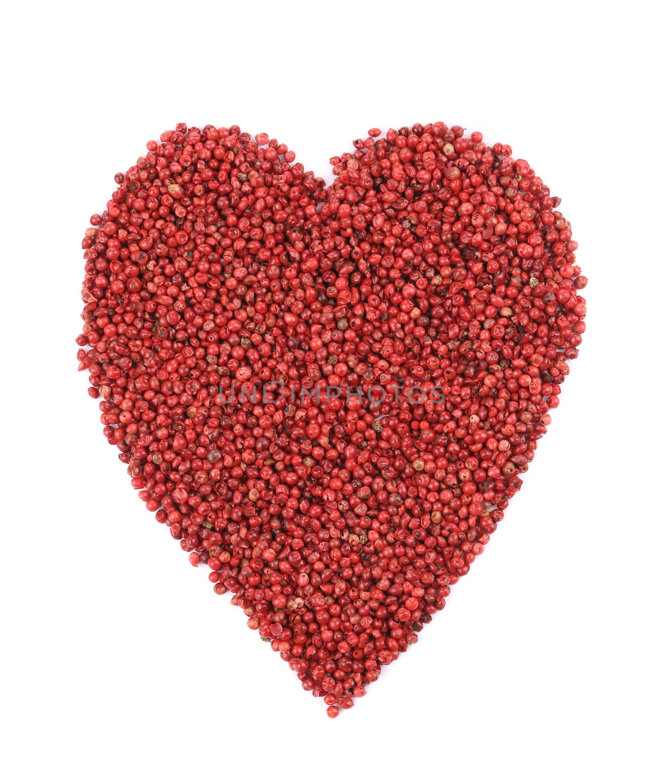 Dried red pepper in shape of heart. Isolated on a white background.