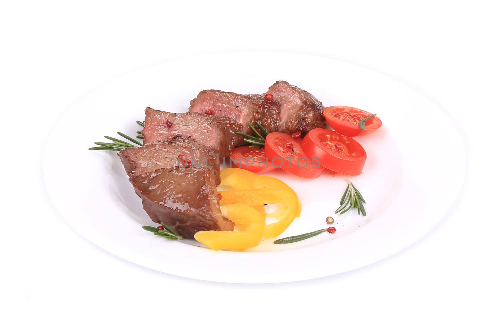 Beefsteaks with tomatoes and rosemary.