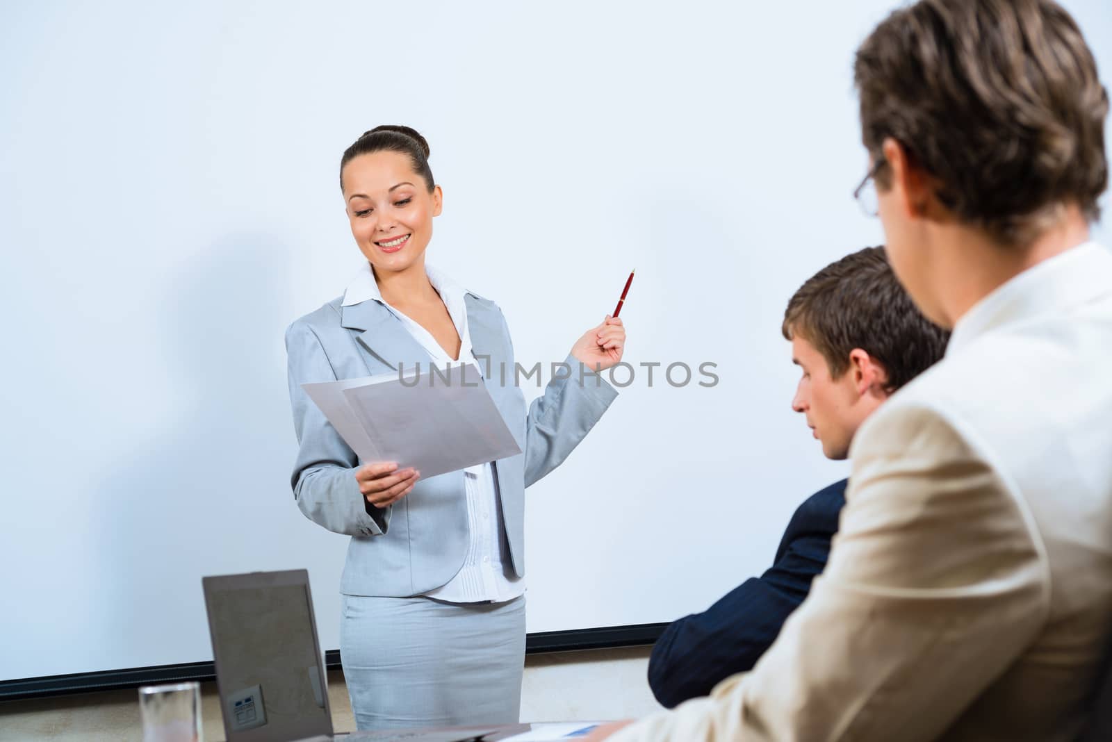 image of a discusses business woman with colleagues