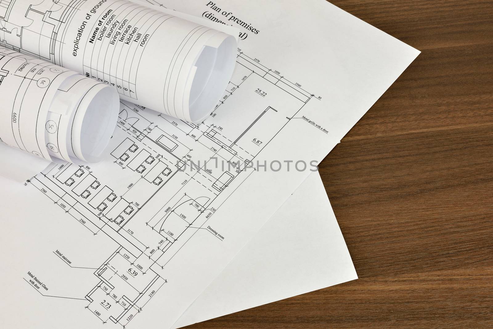 Construction drawings on a wooden surface. Workplace architect