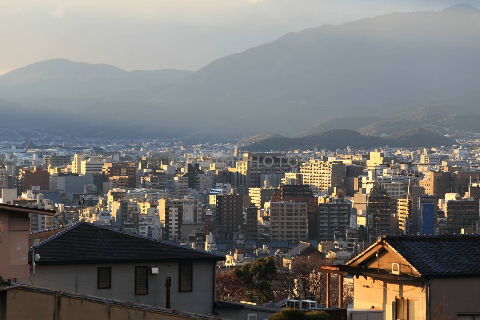 Kyoto, Japan - city in the region of Kansai. Aerial view with skyscrapers. Sunset light.