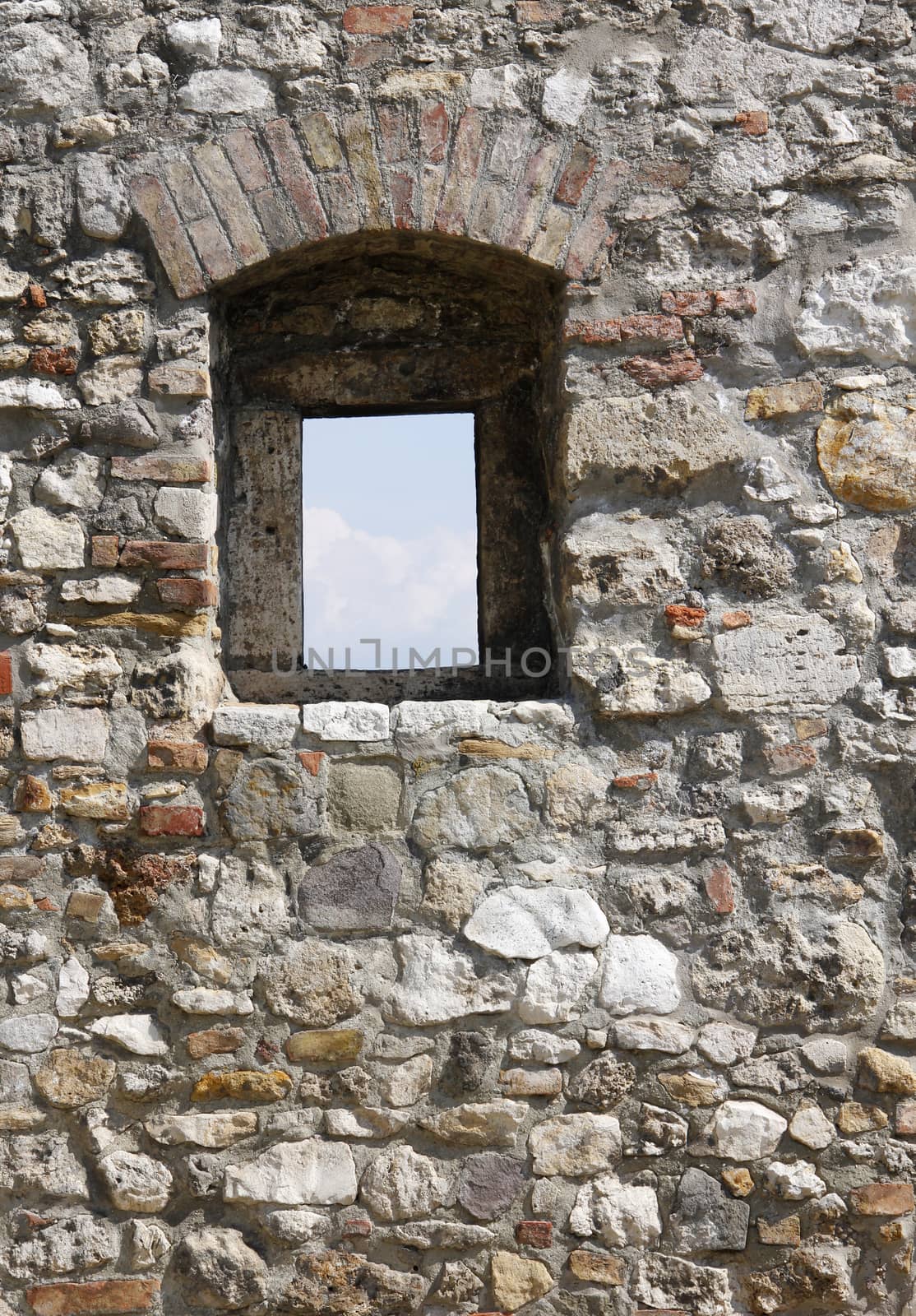 The medieval castle fortress stone wall window.
