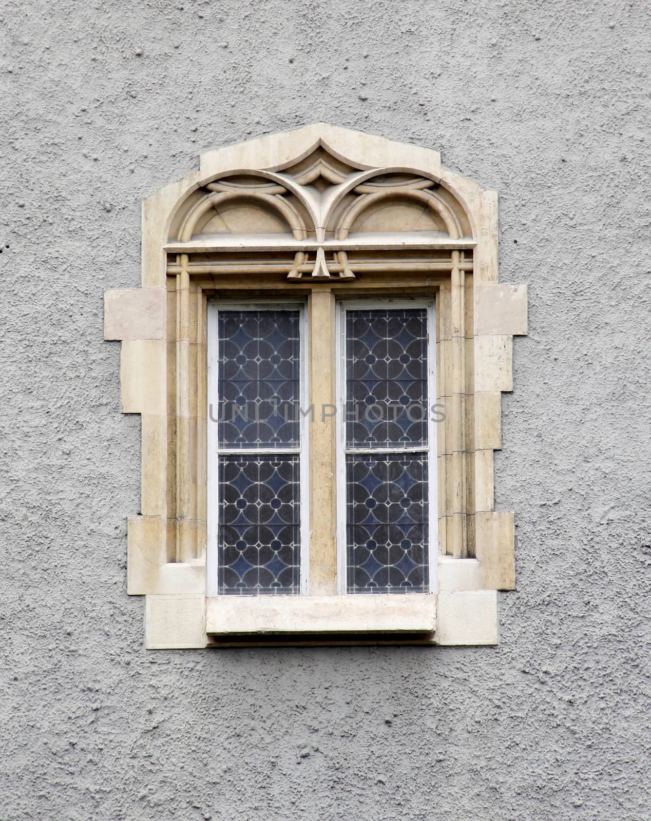 Ornate Gothic castle window in the wall.