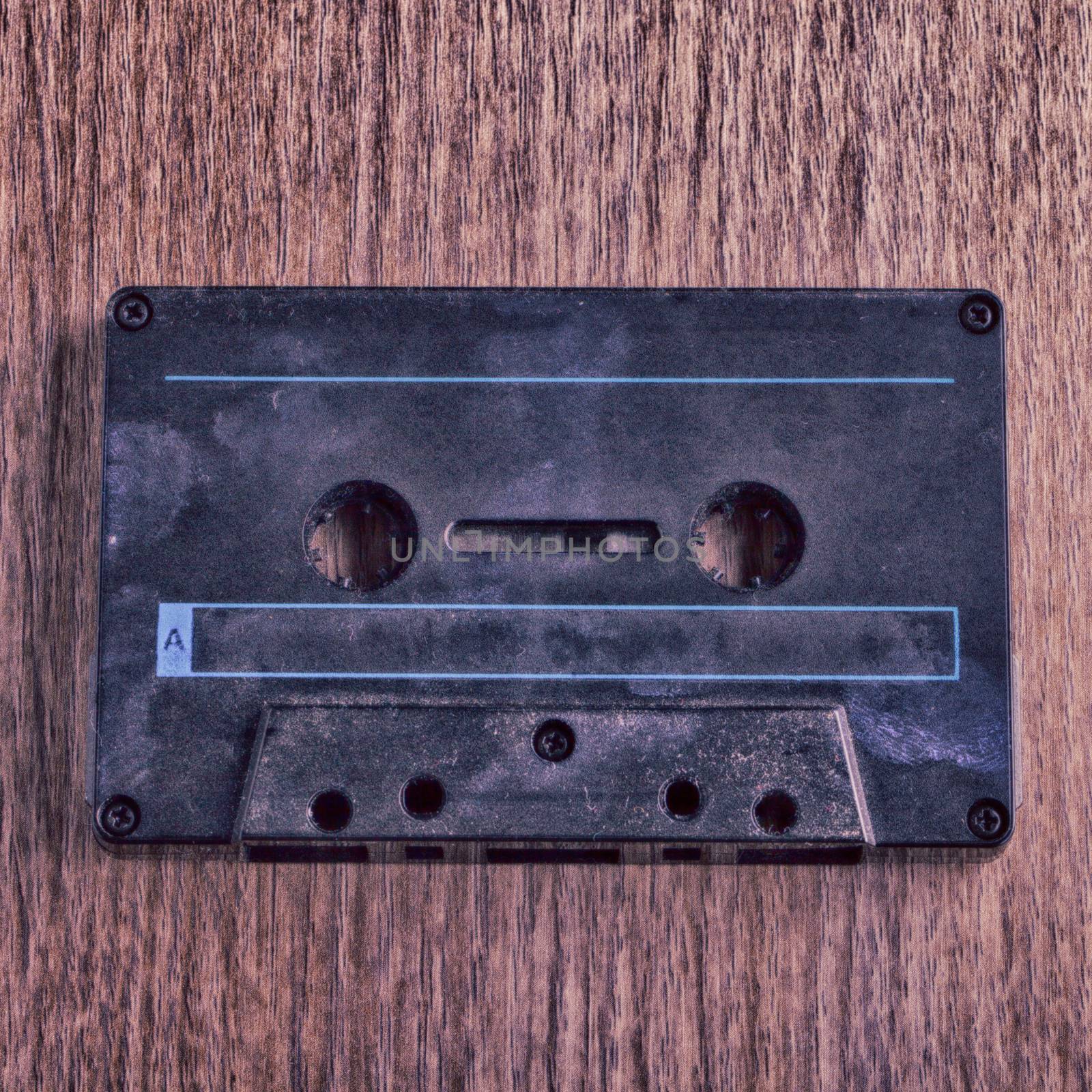 Old and dusty tape over wooden background