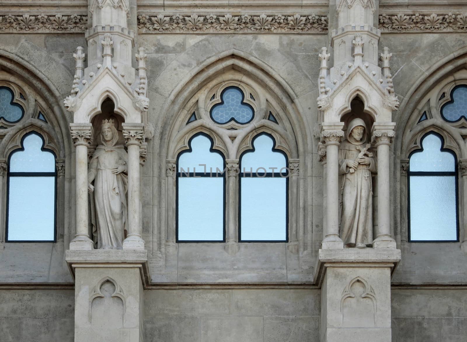 Church exterior ornaments statues and Renaissance windows.