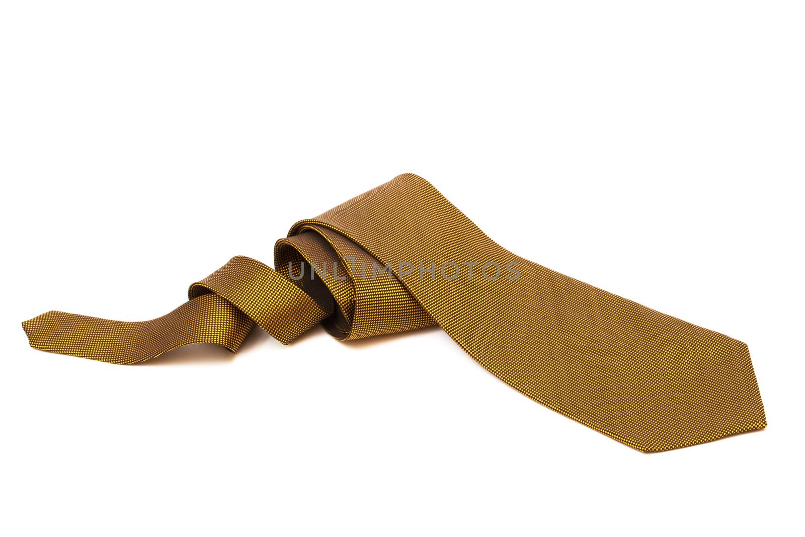 Fashionable gold necktie on a white background