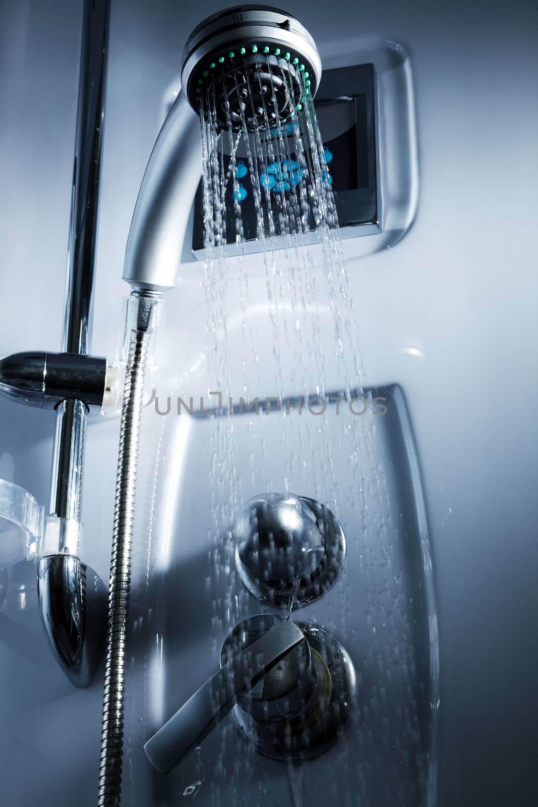 Water from the shower in the modern bathroom