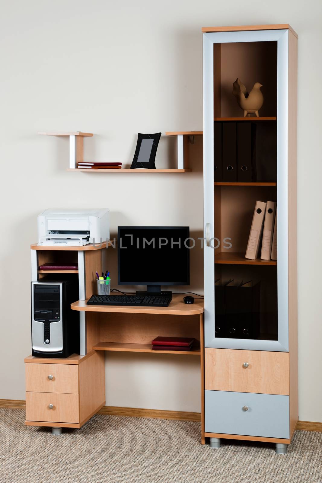 computer on a wooden desk by terex