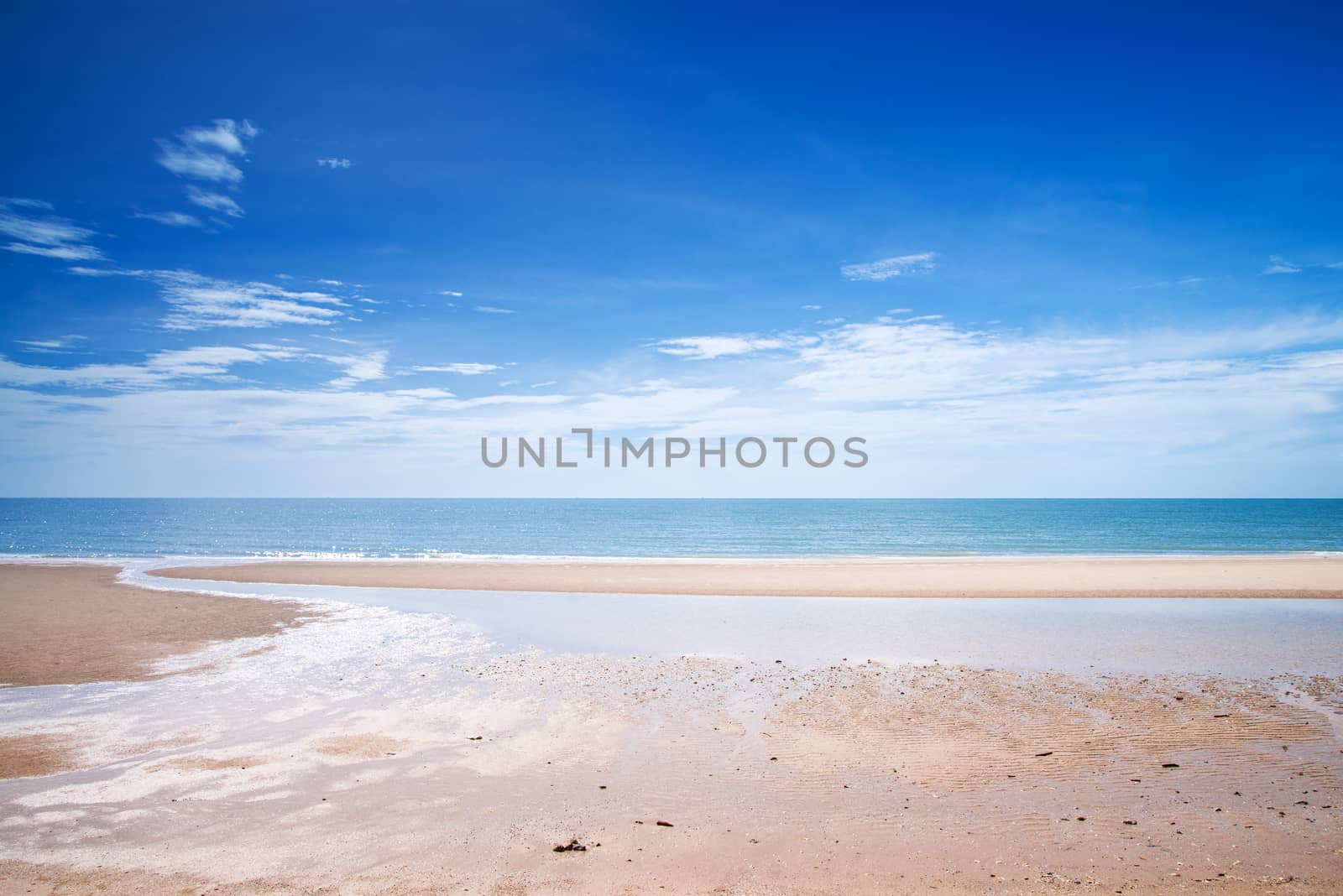 Tropical white sandy beach at sunny day.