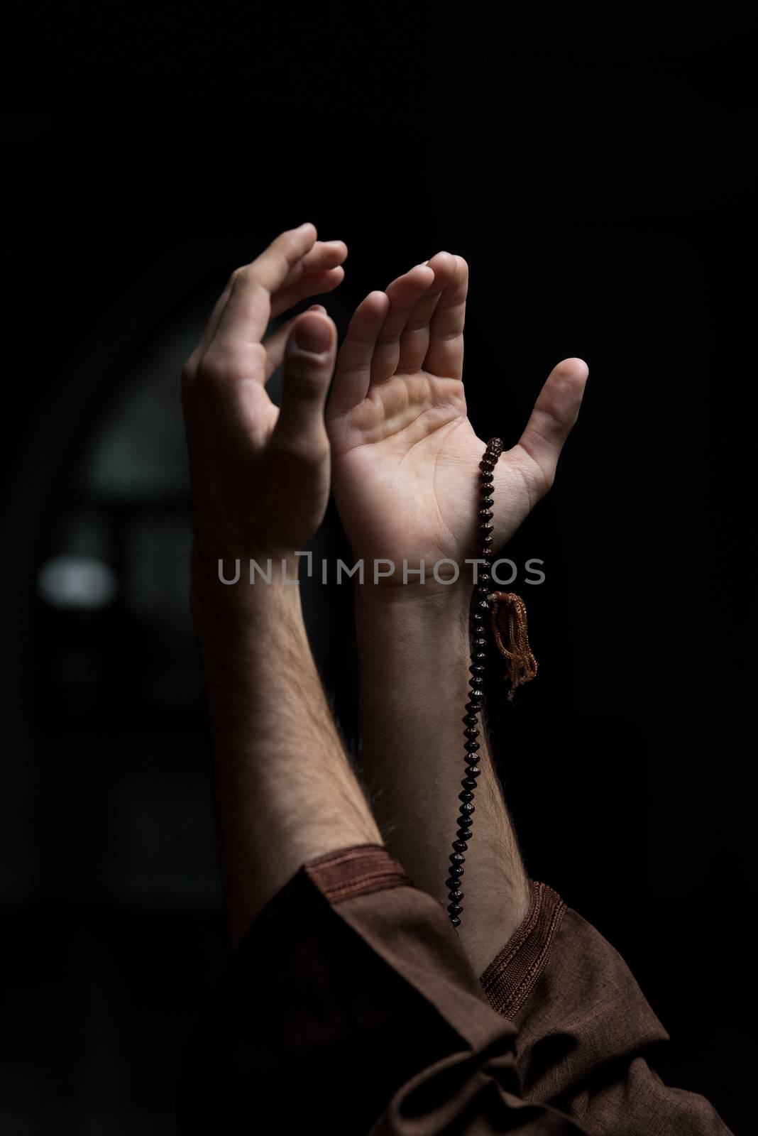 Hands Holding A Muslim Rosary by JalePhoto