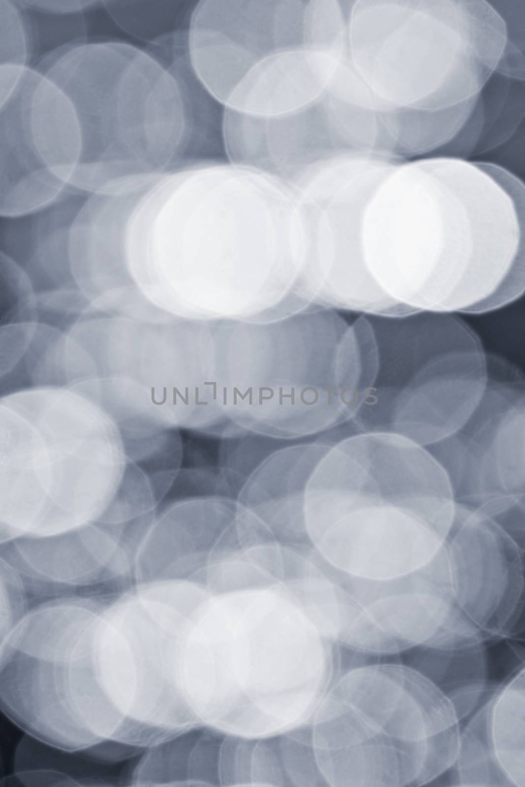 Abstract defocused bokeh grey background of light and shadows