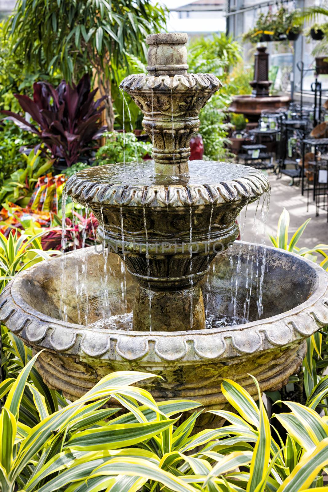 Concrete fountain in garden center by elenathewise