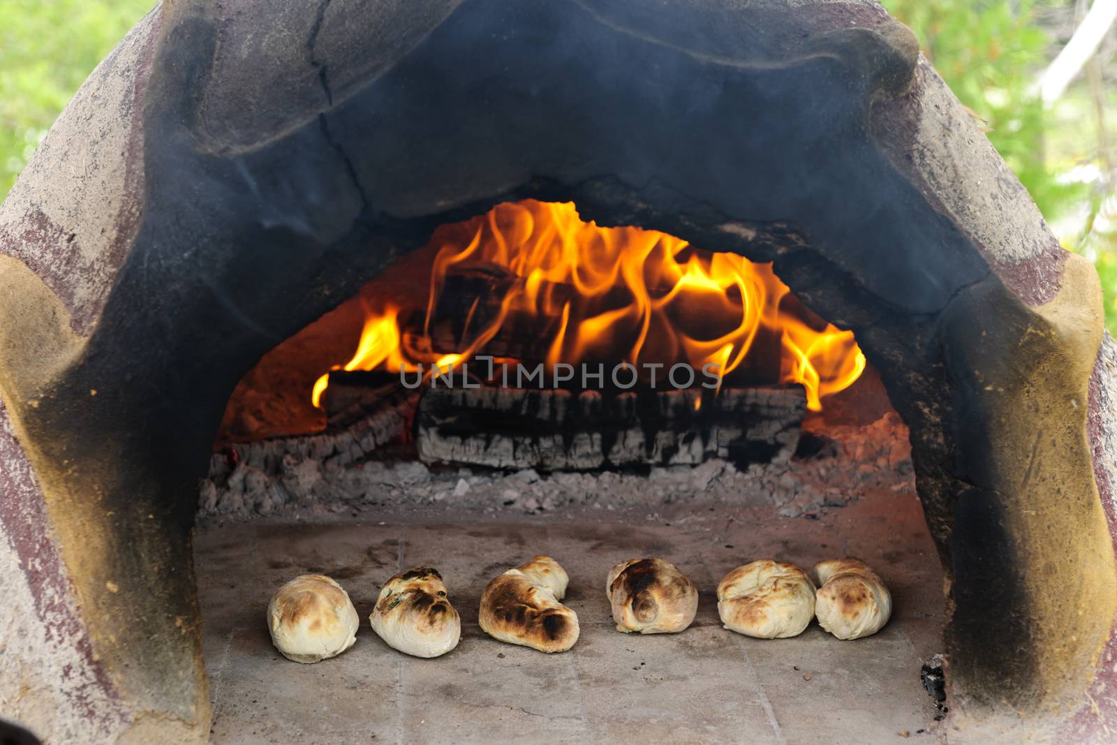 Stone wood oven baking bread by elenathewise