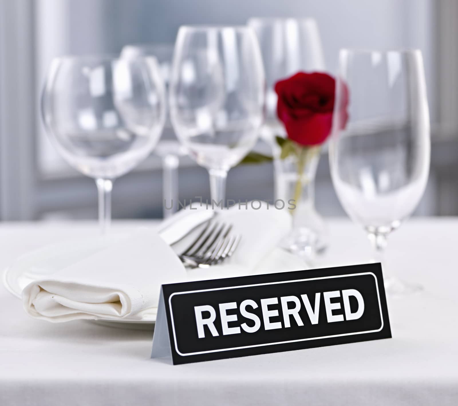 Reserved table at romantic restaurant by elenathewise