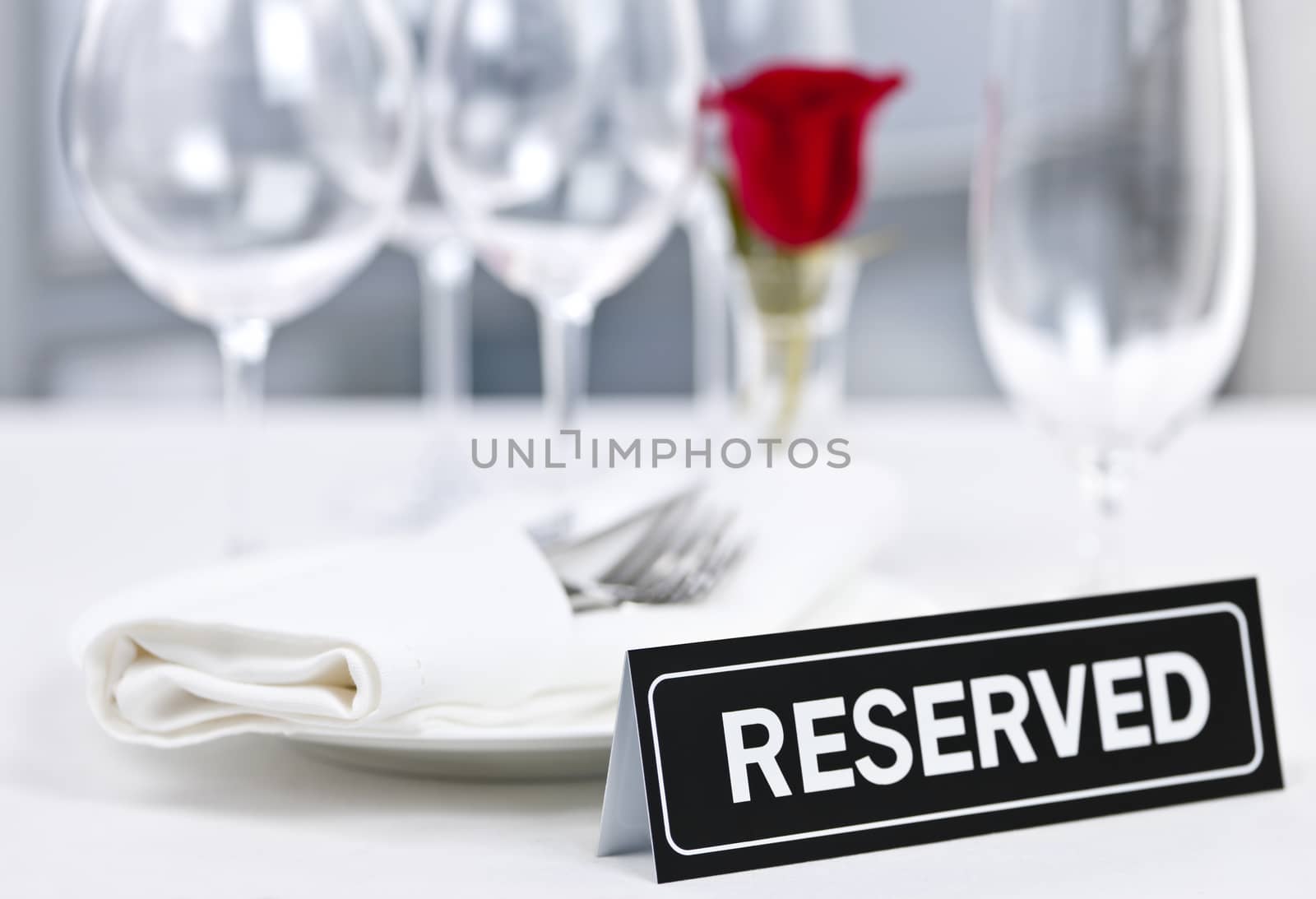 Reserved table at romantic restaurant by elenathewise