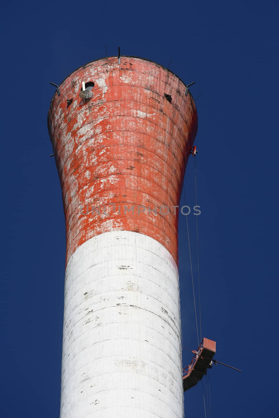 Heat and power central, smoke pipe against clear blue sky