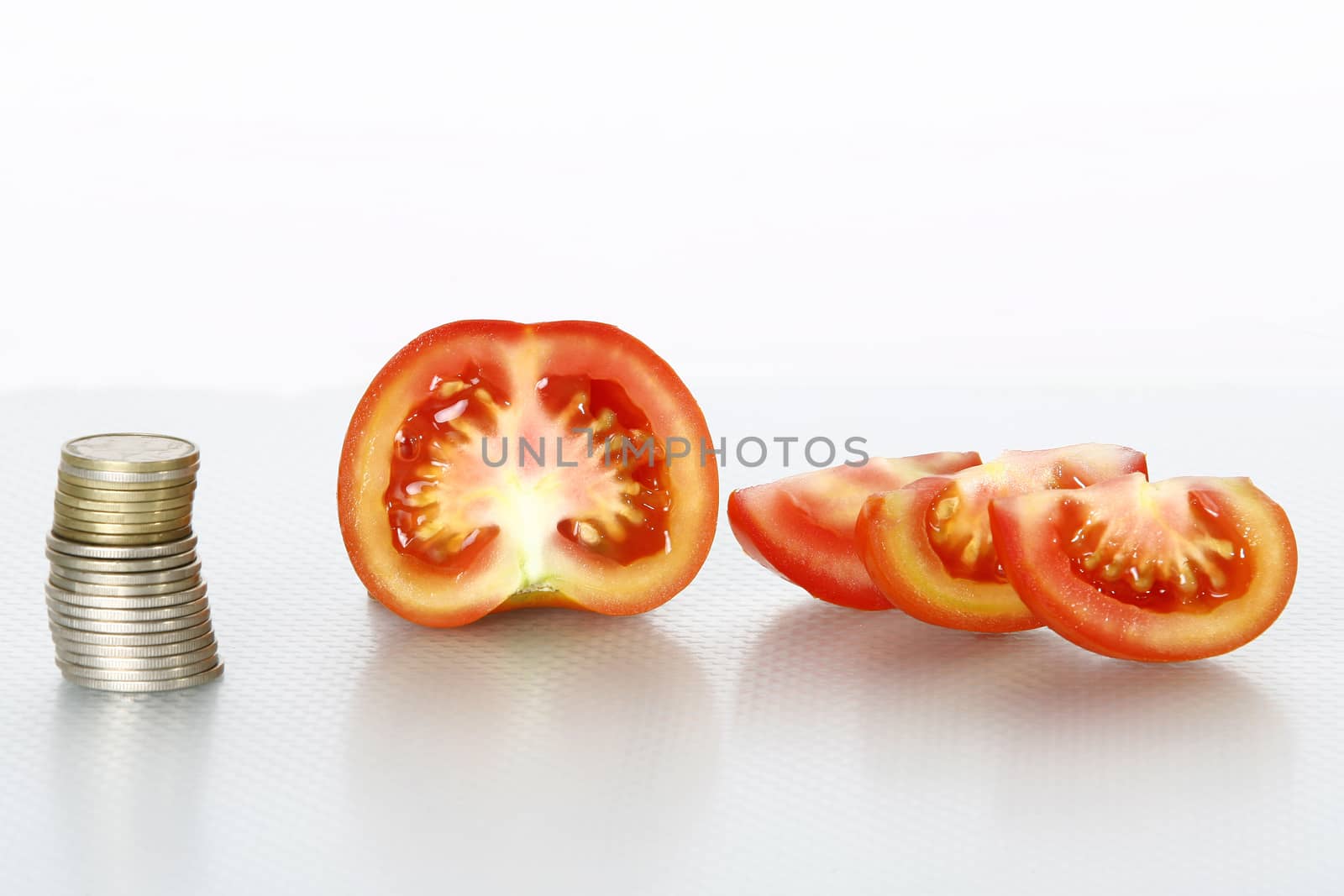 Tomato vegetables pile isolated on white background cutout with coins