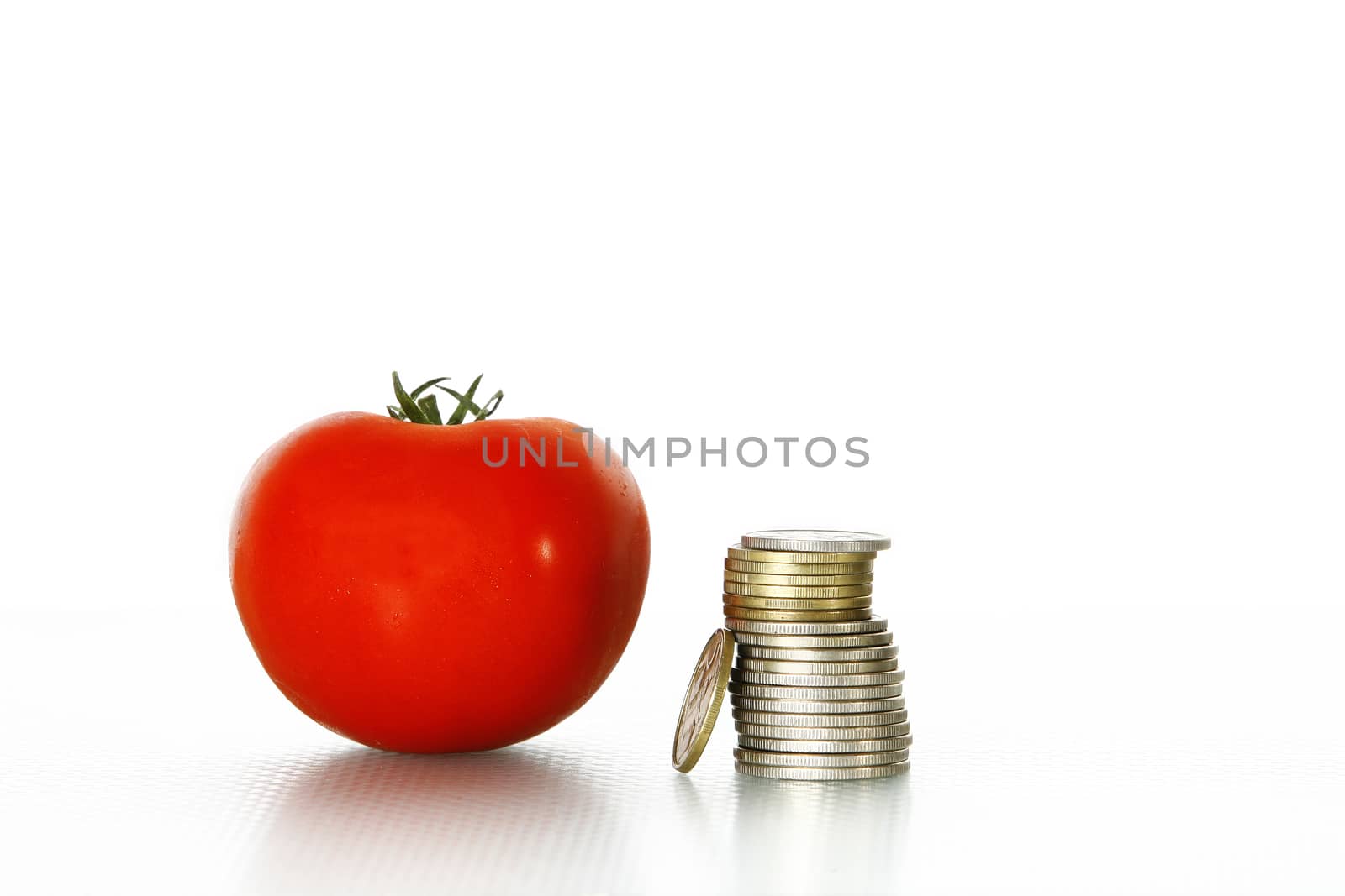 Tomato vegetables pile isolated on white background cutout with coins