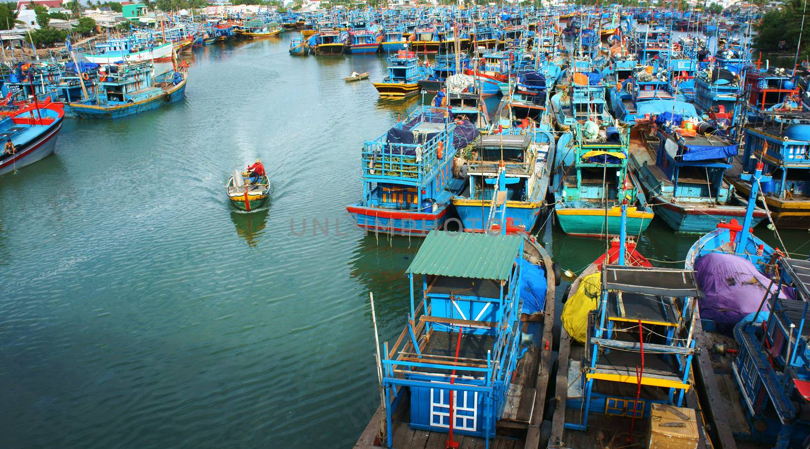 Many multicolor fishing boat anchor like a net at fishing port, with blue tone in horizontal frame. Frebruary 2, 2013