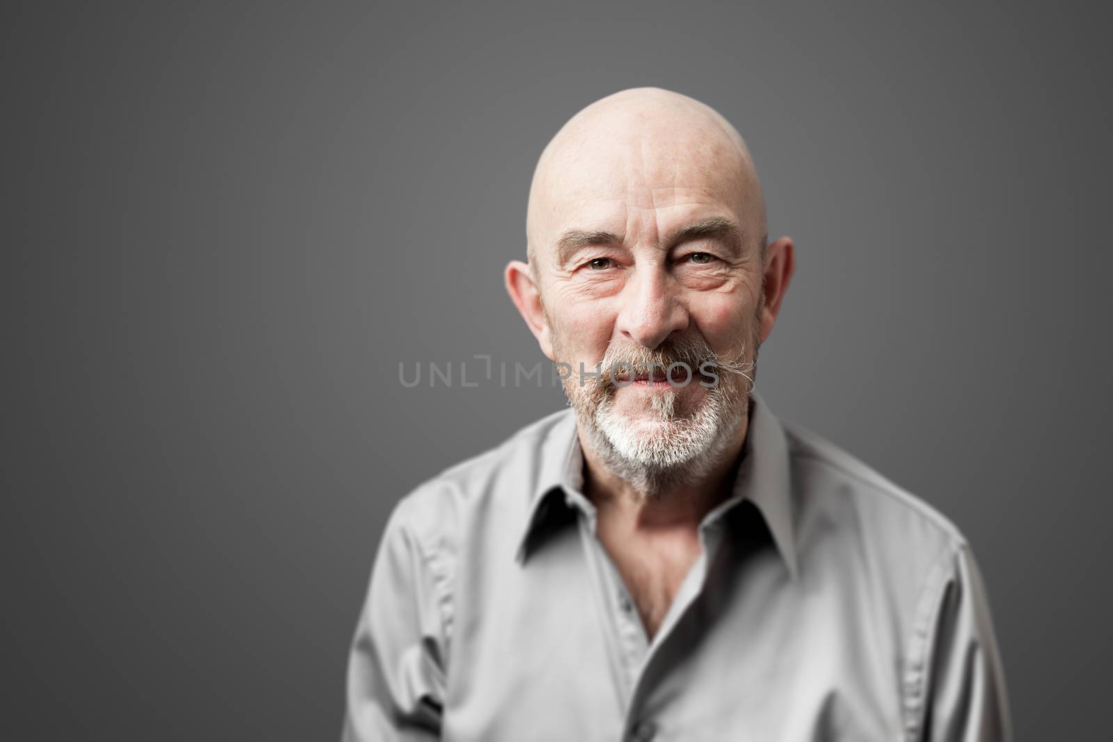 An image of a senior man with a beard