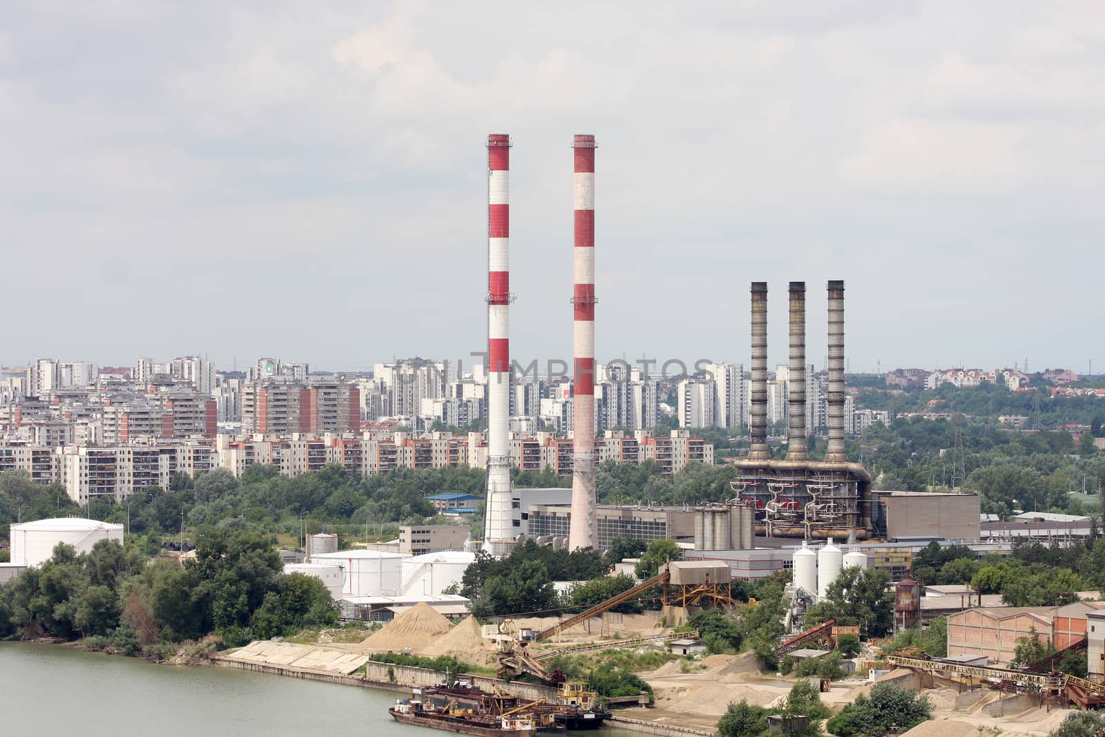 Chimneys of the heating plants, Heating plant in the city by the river