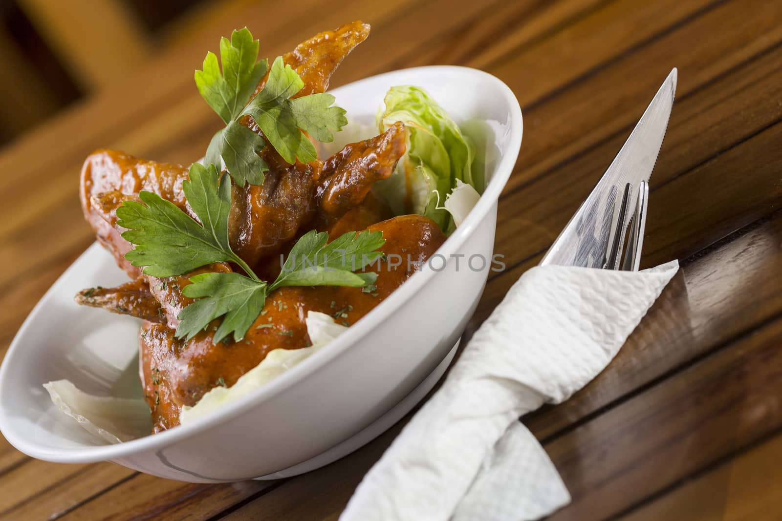 A bowl of Spicy Chicken Wings ready to be served.