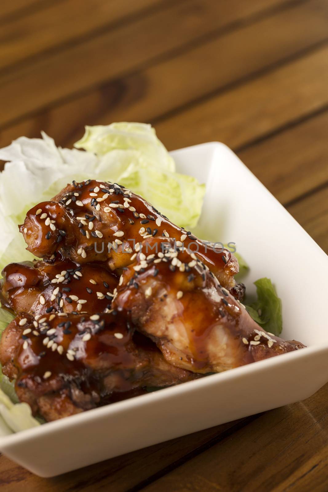 Barbecue buffalo wings with sesame sauce ready to be served.