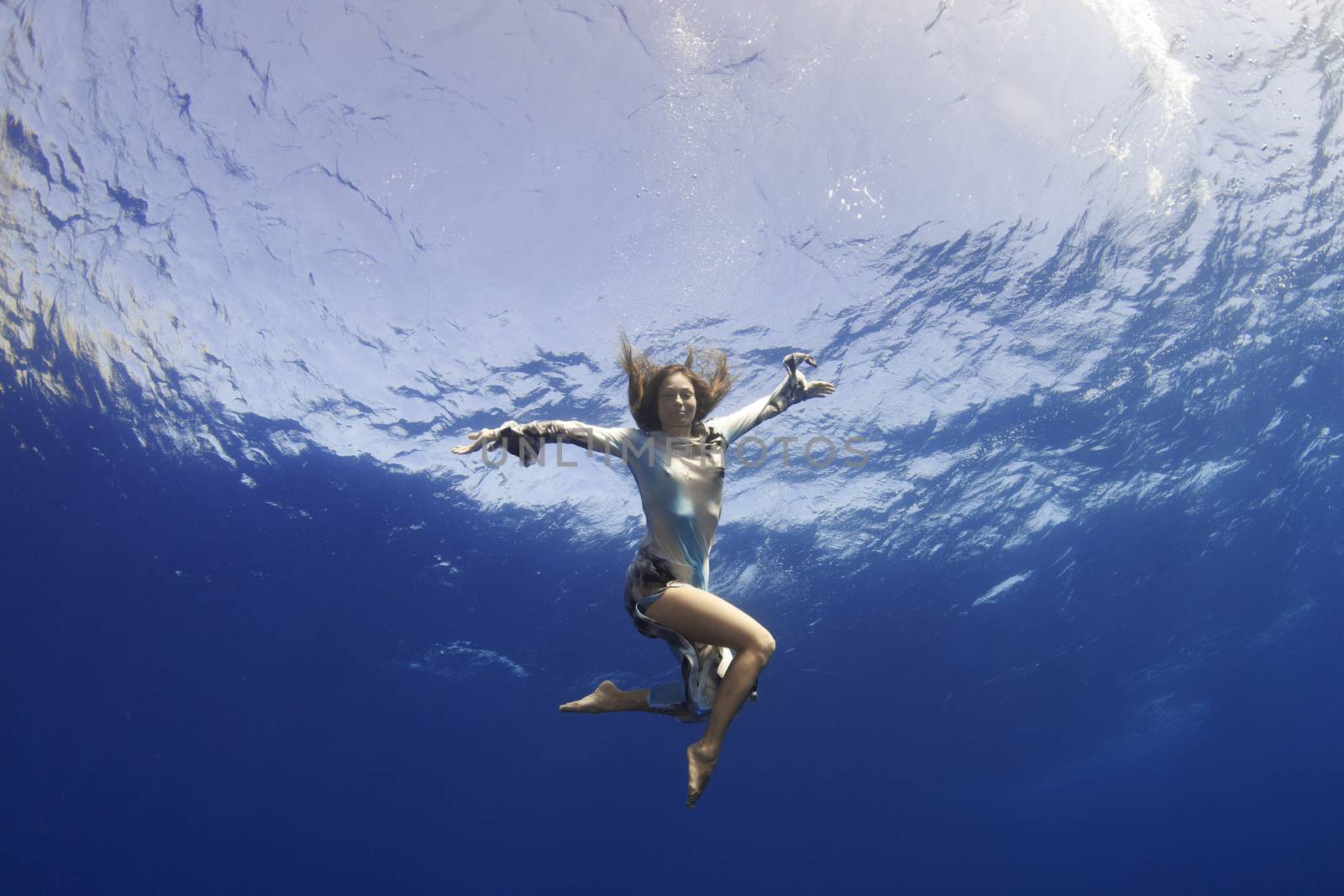 girl giving hand to you underwater by vsurkov