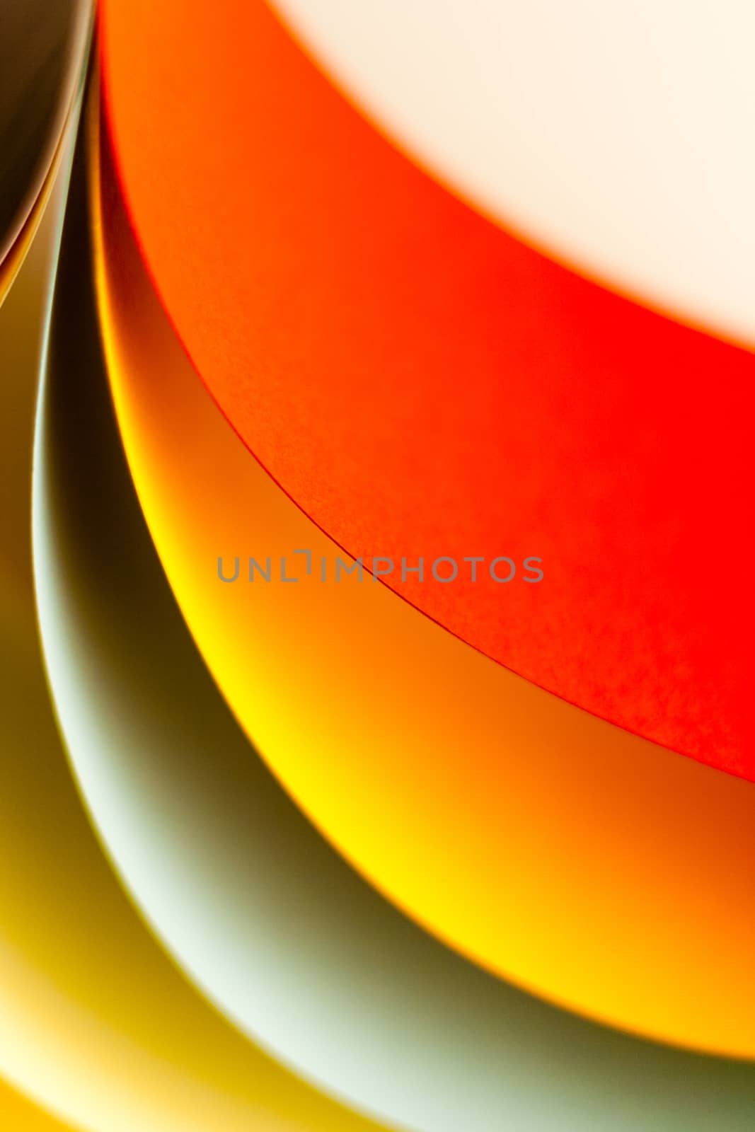 Colorful paper in unique shapes with shadow effect and selective focus.