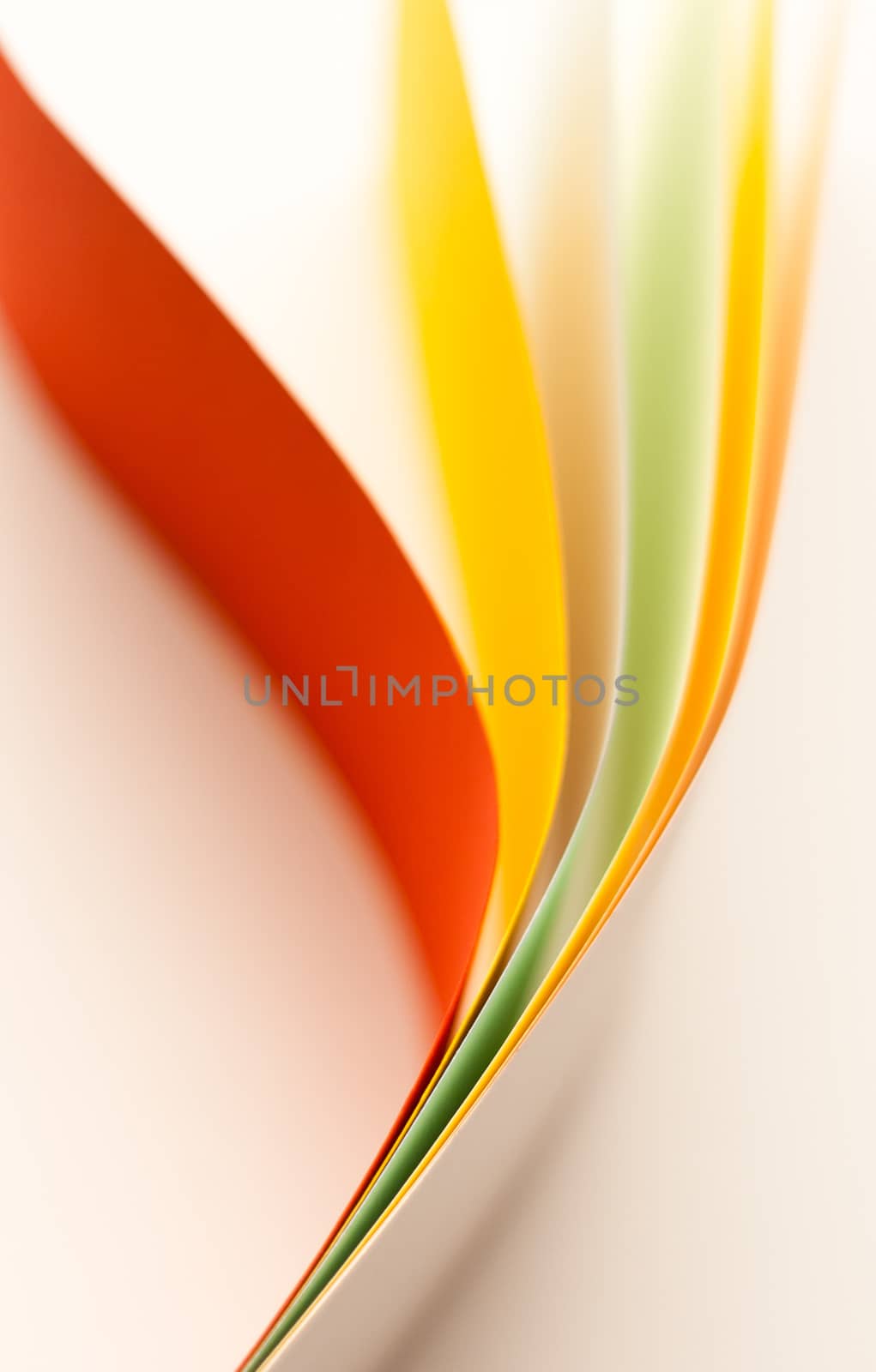 Colorful paper in unique shapes with shadow effect and selective focus.