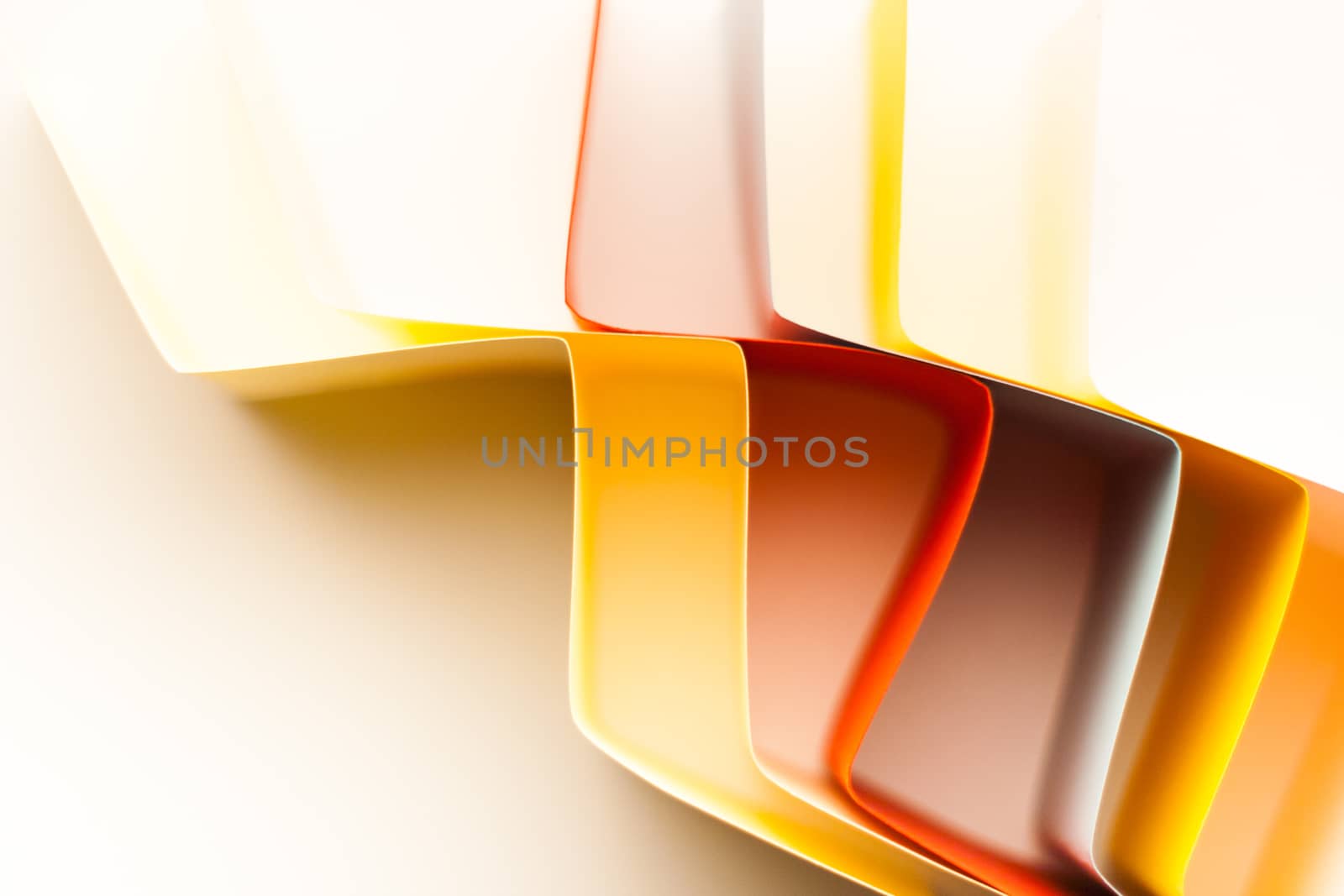 Colorful paper in unique shapes with shadow effect and selective focus.