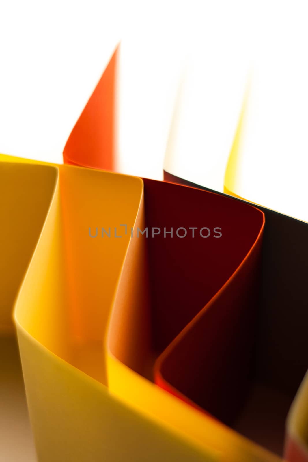 Colorful paper in unique shapes with shadow effect and selective focus.