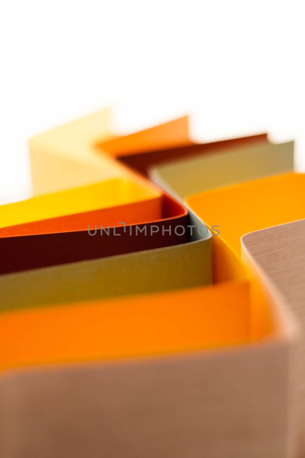 Colorful paper in unique shapes with shadow effect and selective focus.