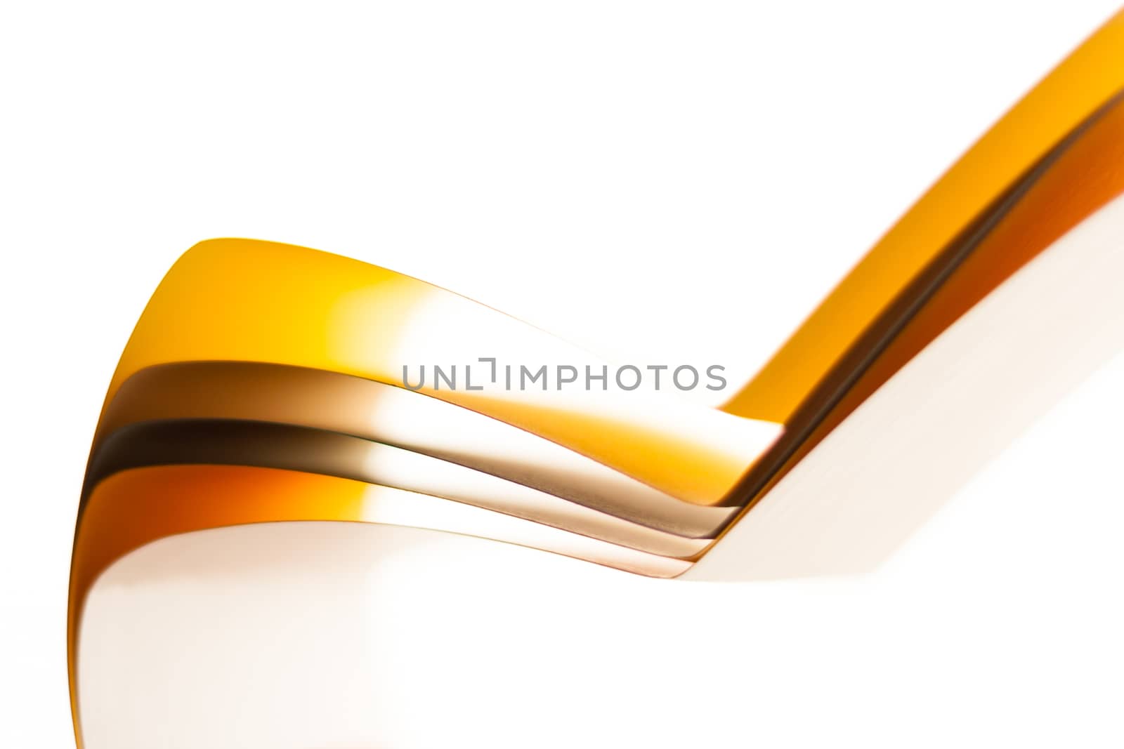 Colorful paper in unique shapes with shadow effect and selective focus.