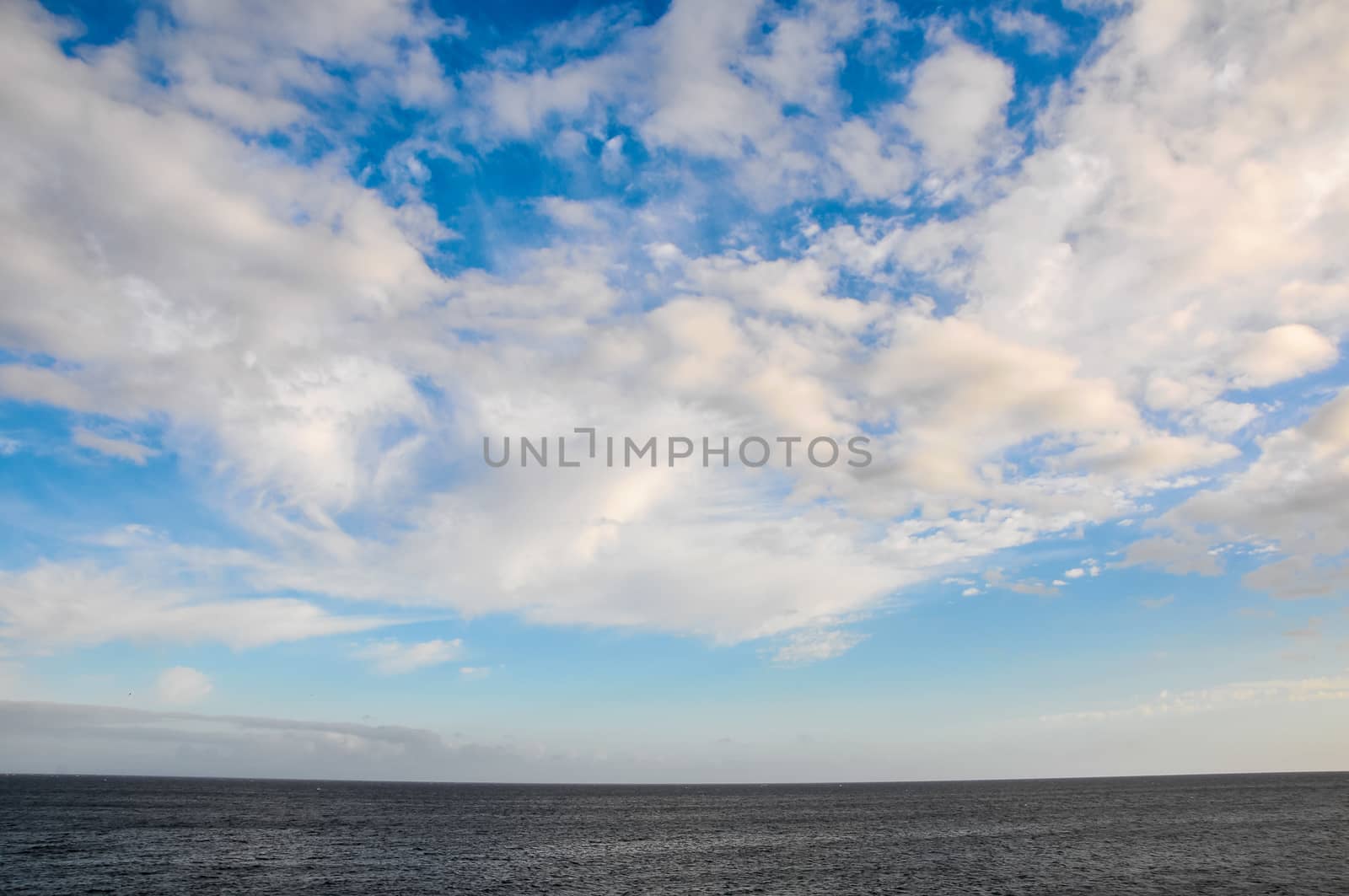 Cloudscape, Colored Clouds at Sunset near the Ocean