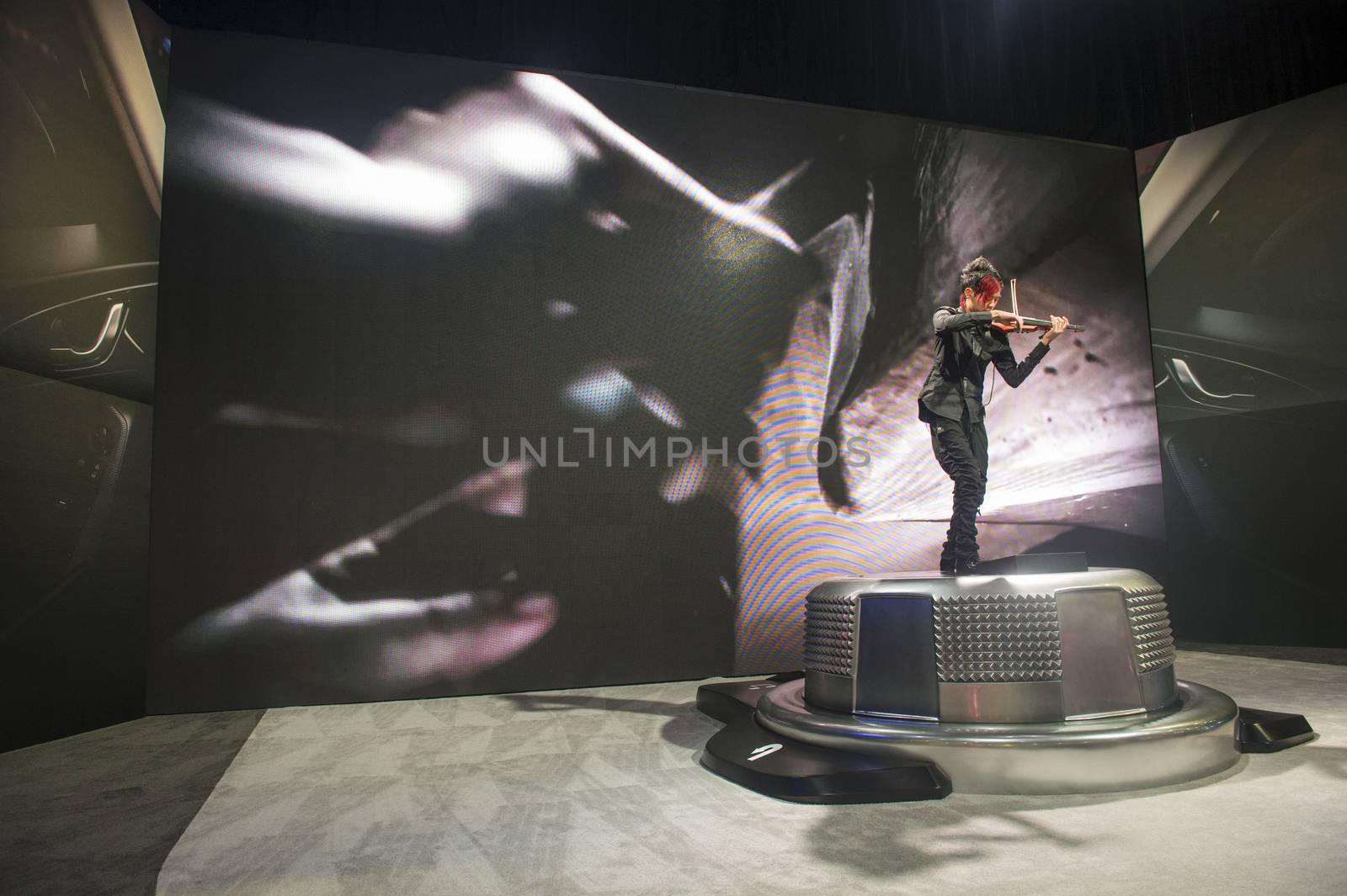 LAS VEGAS - JAN 10 : Violinists at the Mazda booth at the CES Show in Las Vegas, Navada, on January 10, 2014. CES is the world's leading consumer-electronics show 