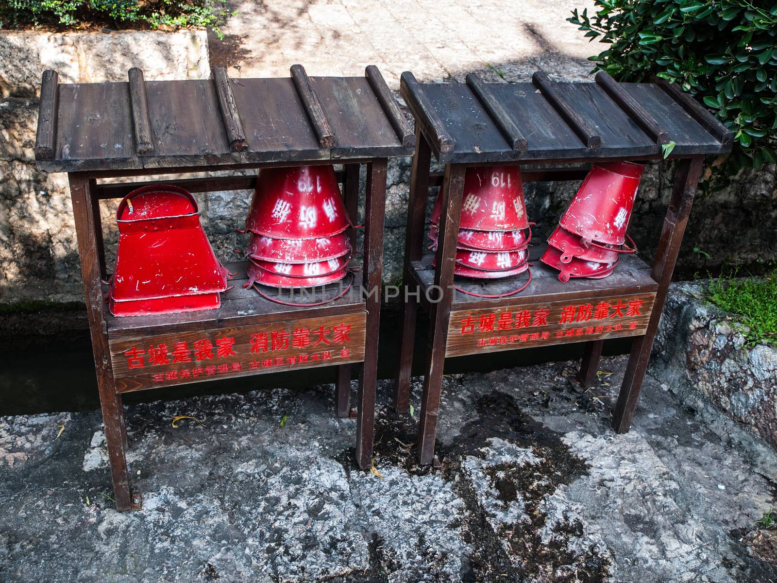 Fire buckets on the street (Lijiang, Yunnan, China)