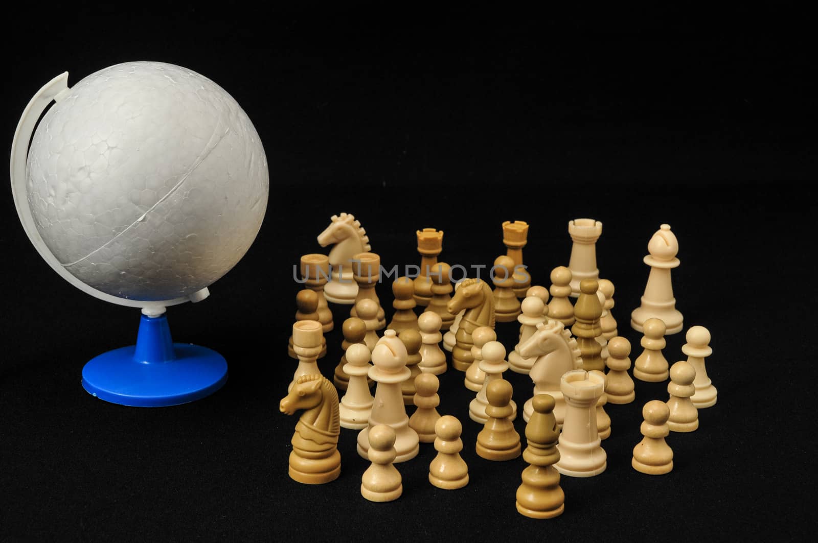 Globe And White Chess on a Black Background