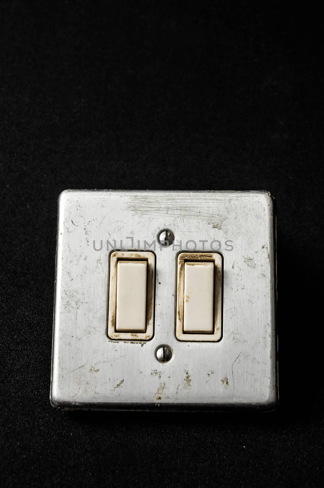 Light switch, old-style on a Black Background