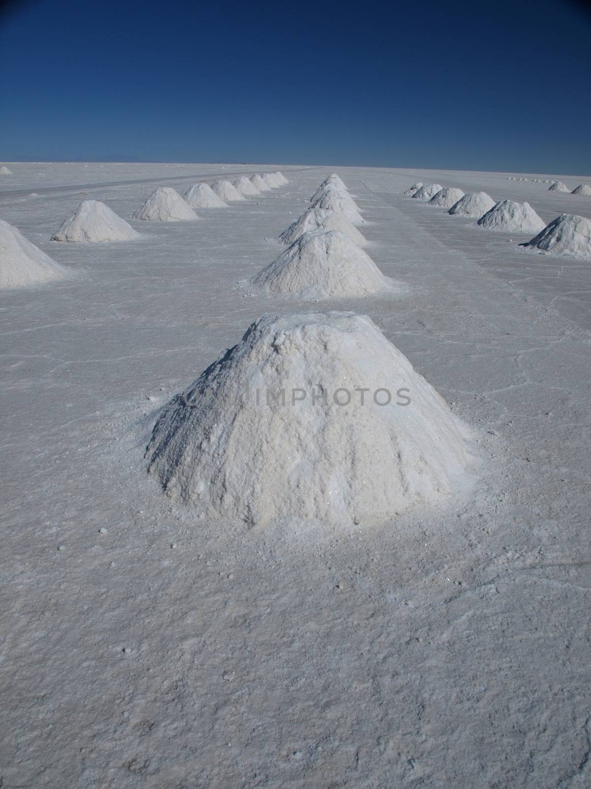 Uyuni salt plain with salt piles   by pyty