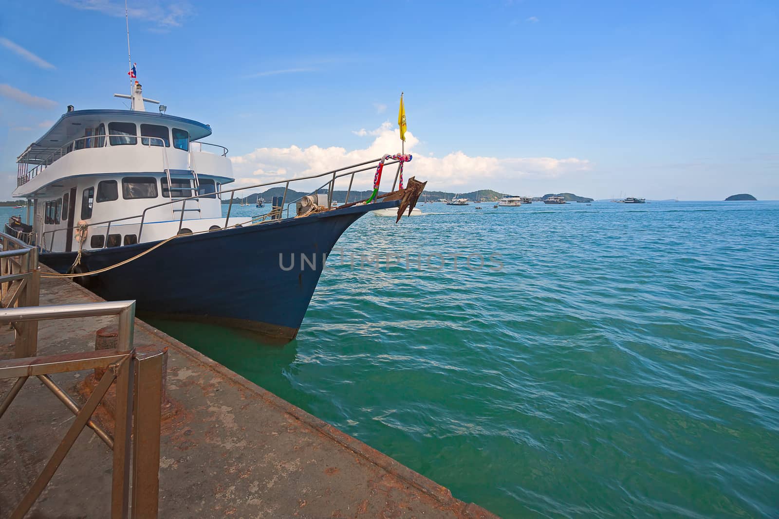 Ships  at berth waiting for tourists, Andaman Sea, Thailand.
