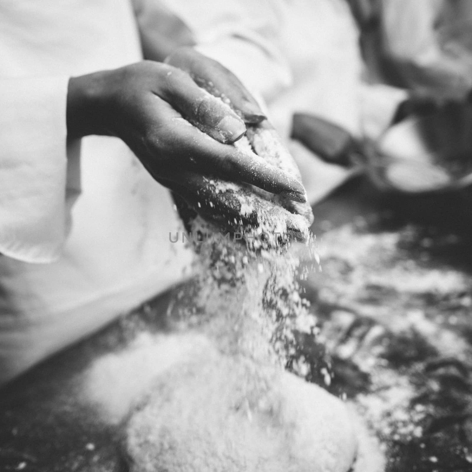 Chef preparing dough at counter by Wavebreakmedia