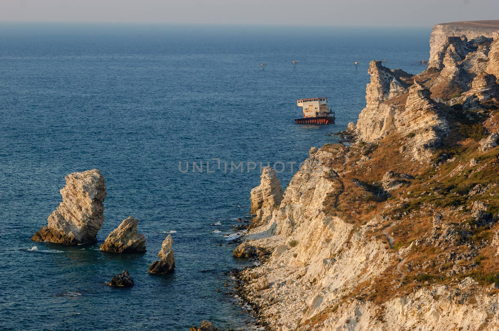 Coastline of Tarhankut in rays of sunset, Crimea, Black Sea, Ukraine